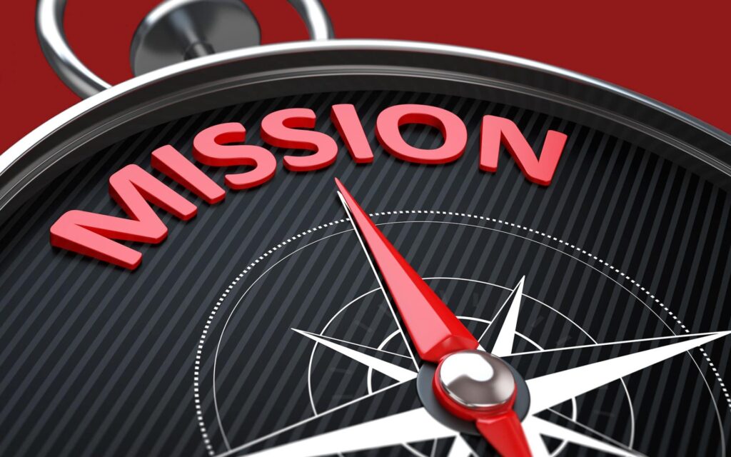 A compass with the word Mission